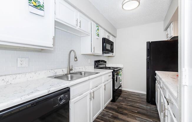 a kitchen with a stove and a refrigerator