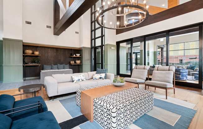 a living room with couches and chairs and a coffee table