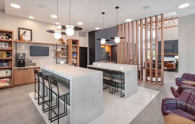 a kitchen and living room with a marble counter top