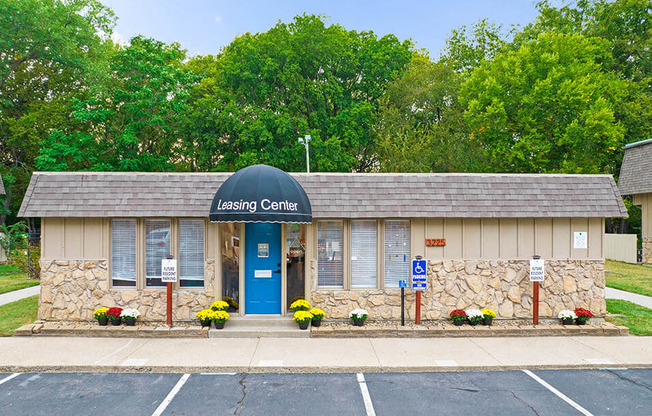 the leasing center is located on the corner of a parking lot