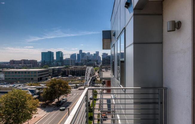 a view of the city from the balcony of a building