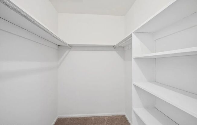 Large walk in closet with tons of storage