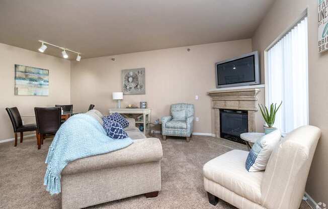 A living room with a fireplace and a couch.