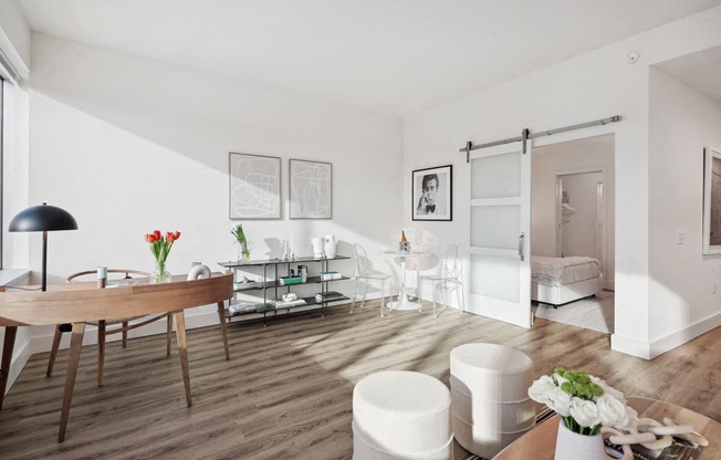 a living room and dining room with a table and chairs at Sinclaire on Seminary, Virginia