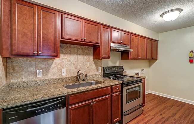 Kitchen with stainless steel appliances at River Crossing Apartments, Georgia