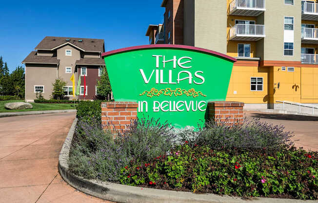 The Villas in Believe sign in front of a building.