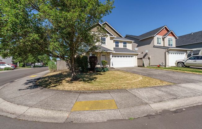 Your Next Home Awaits! 4BR/2.5BA with Fenced Yard & Garage