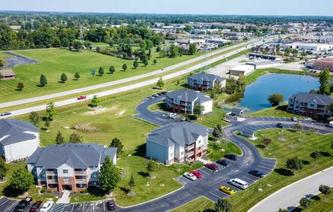 an aerial view of a neighborhood with houses and a parking lot