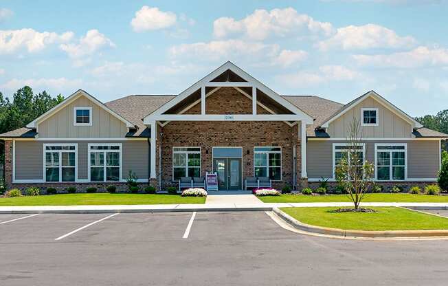 a large house with a parking lot in front of it