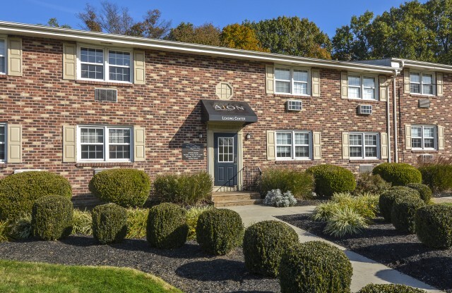Exterior view of The Wellington apartment complex leasing office in Hatboro, PA