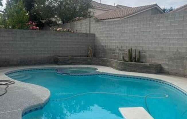 THIS BEAUTIFUL TWO STORY HOME WITH POOL