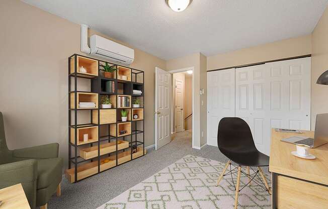 A room with a green chair, a wooden shelf, and a desk with a laptop on it.