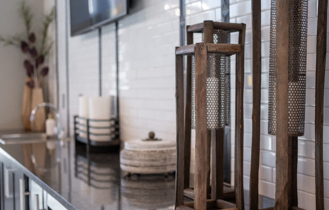 a bathroom with a sink and chairs in it