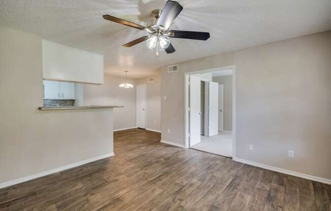 Living Area with Ceiling Fan at Bookstone and Terrace Apartments in Irving, Texas