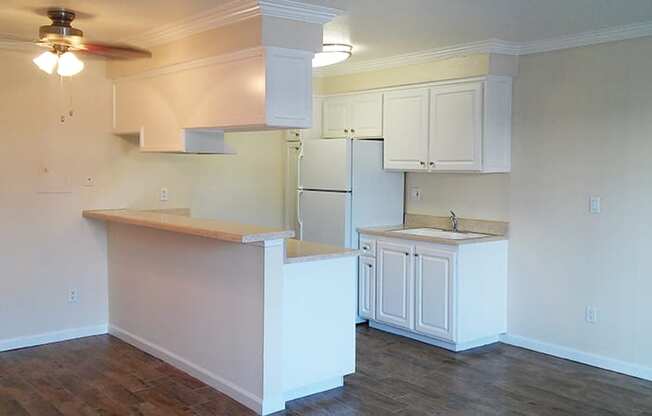 View of kitchen with white cabinets