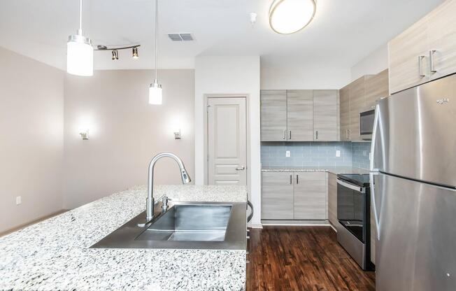 a modern kitchen with stainless steel appliances