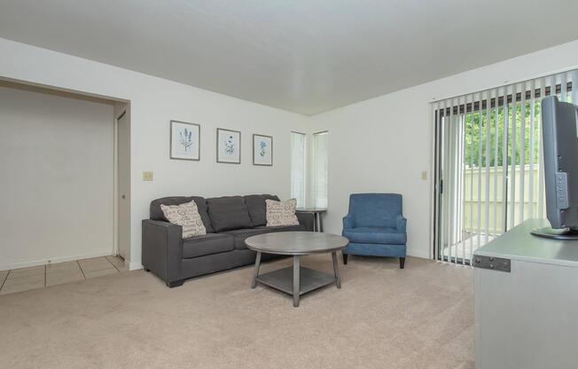 a bedroom with a bed and desk in a room