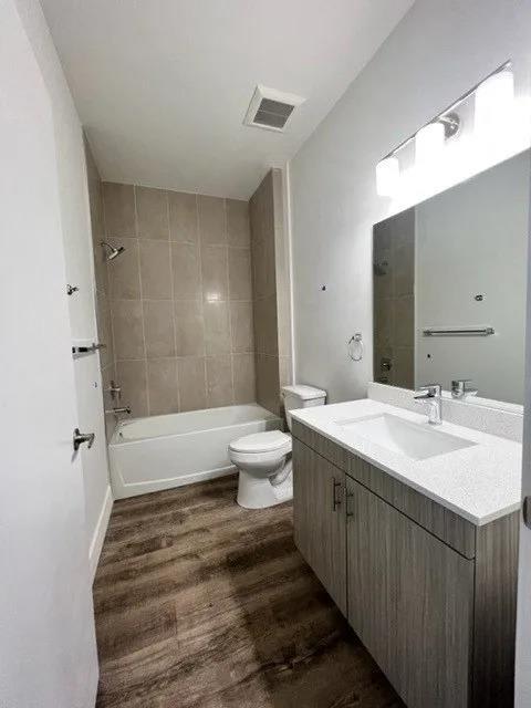 a bathroom with a toilet sink and a mirror