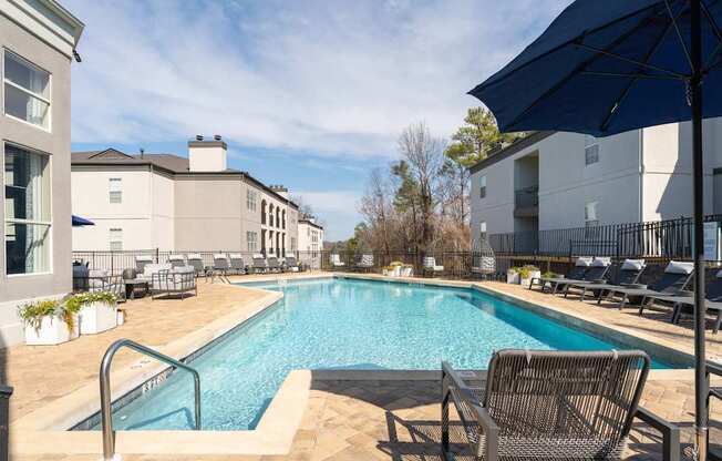 our apartments have a resort style pool and lounge chairs
