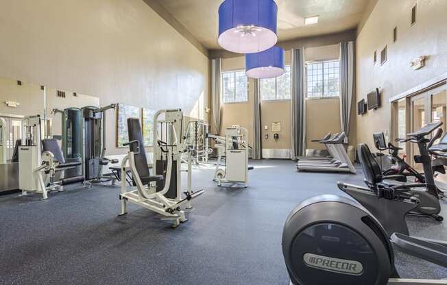 Apartments near Alief Texas for Rent – Gramercy Park – a gym with cardio equipment and weights