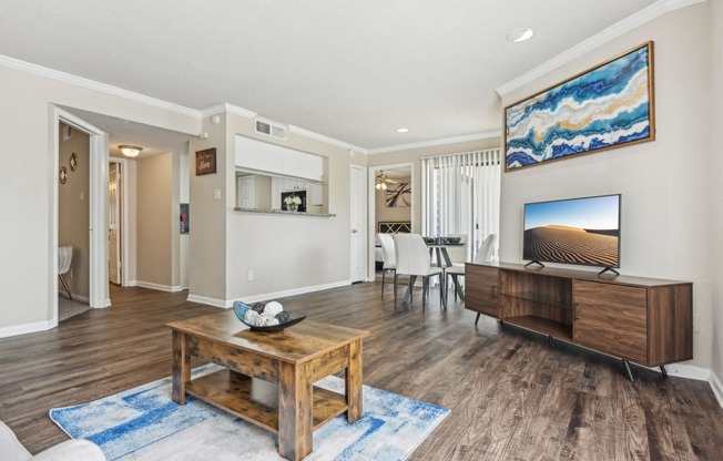 a living room with a table and a television