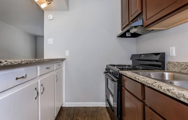 a kitchen with a stove and a sink