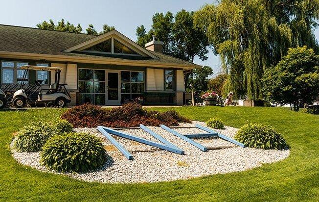 Beautifully landscaped exterior of a golf course main building in New Hope, MN.