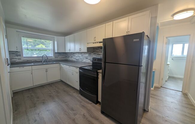 Cute and Cozy, Centrally Located Triplex with Yard