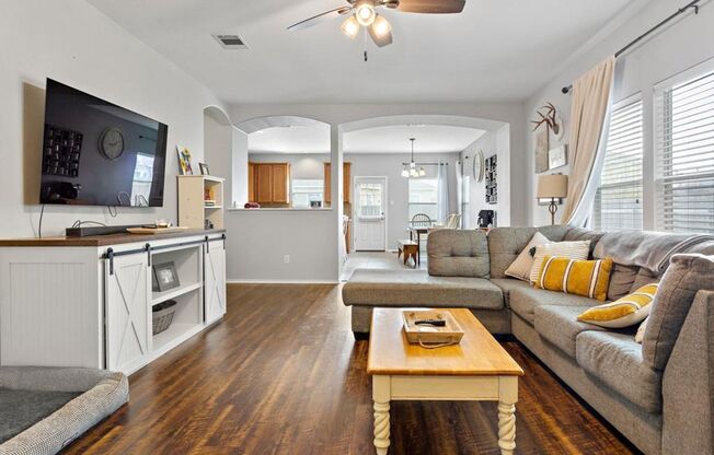 Open Floorpan is Move in Ready just for you! Wood look laminate and Tile run throughout the home with carpet only in the bedrooms.