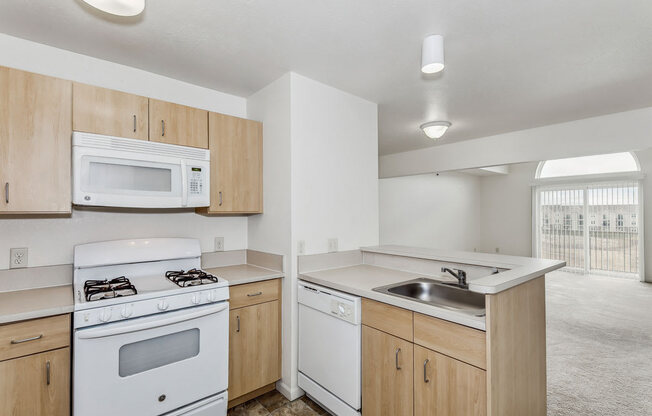 Two Bedroom Kitchen with a View at Stoney Pointe Apartment Homes in Wichita, KS