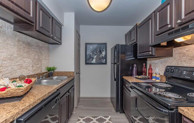 a large kitchen with stainless steel appliances