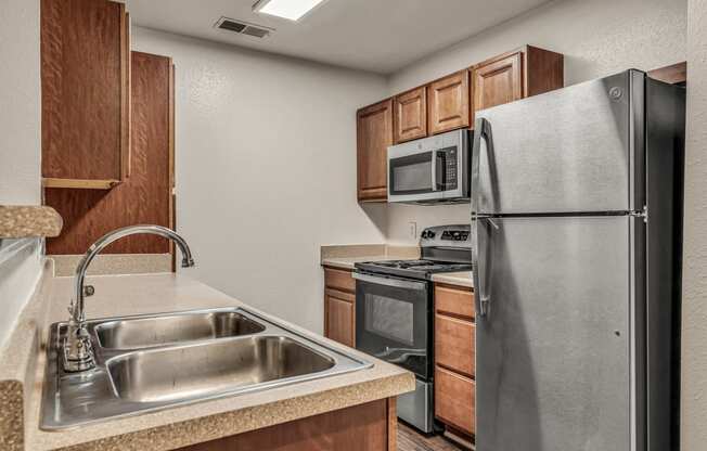 a kitchen with stainless steel appliances and a sink