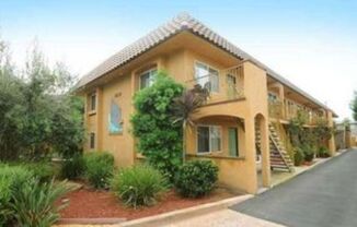 Upstairs end unit with AC and a private entrance 2 bedroom condo in a quiet area of Spring Valley with a one car garage and a parking spot