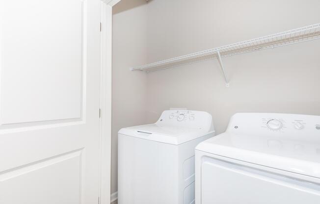 a white refrigerator freezer sitting in a room