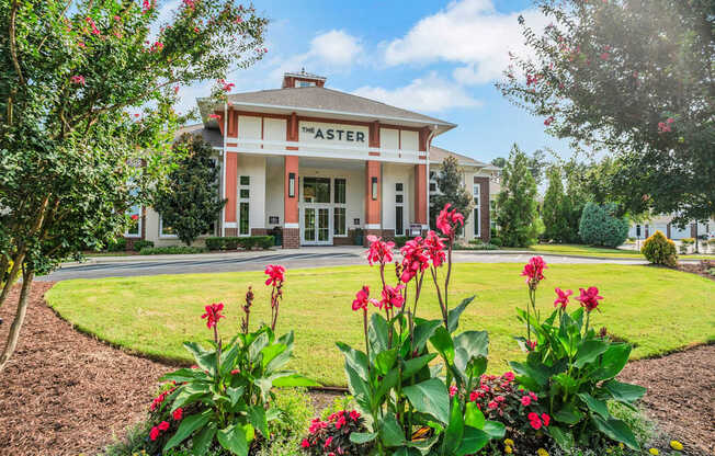 A red and white building with the word "ASTER" on it.