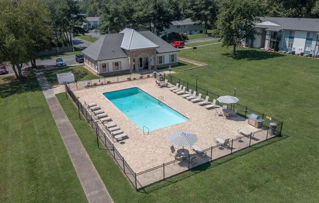 an aerial view of a swimming pool with a house in the background  at The Madison Franklin, Franklin, Tennessee