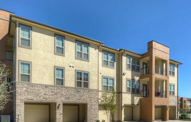 a large brick building with a parking lot in front of it