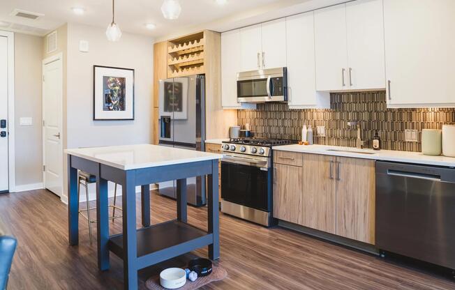 Gourmet kitchens feature bold tile backsplash and oversized single basin sinks.