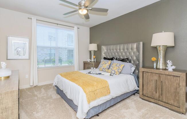 a bedroom with a bed in a room