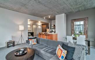 a living room with a gray couch and a coffee table