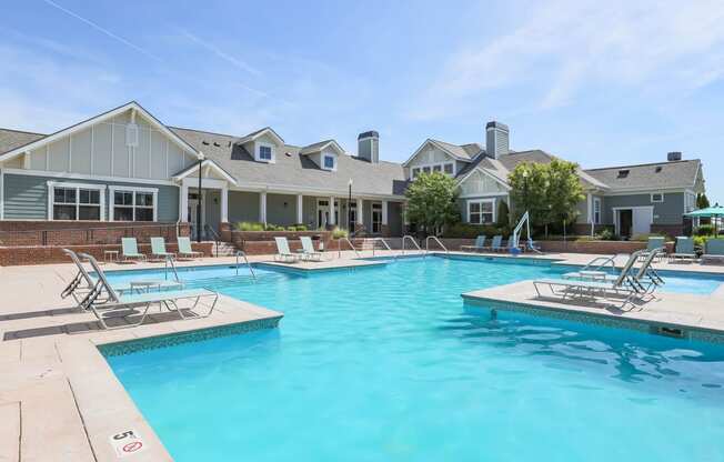 our apartments have a large swimming pool with chairs