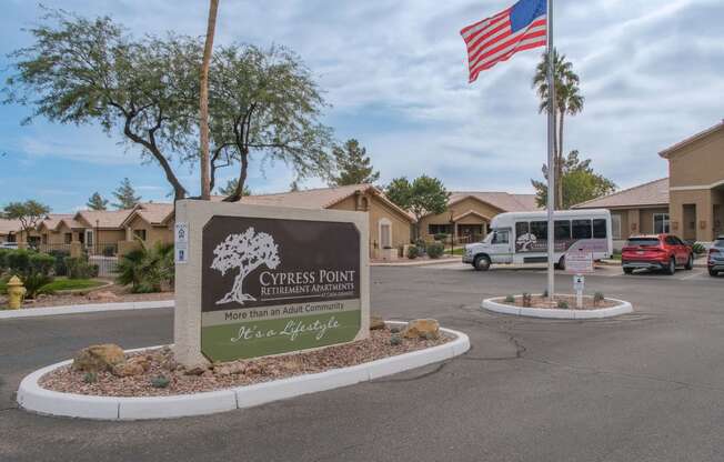 the sign at the entrance of church pointe apartments parking lot flag