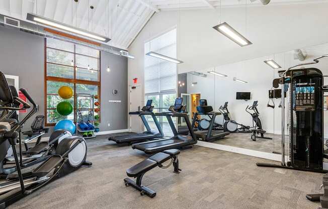 the gym with treadmills and weights