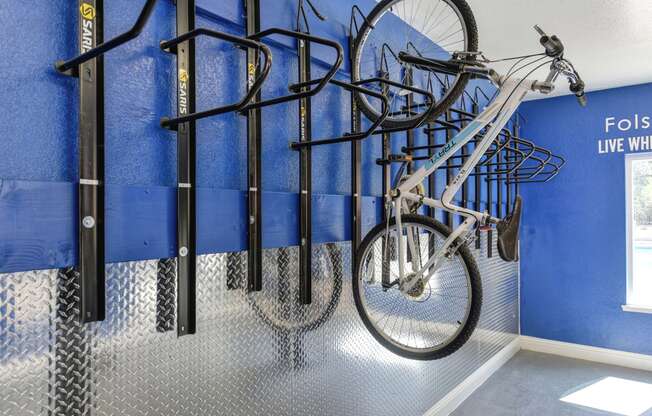 Community bike storage room which was designed for residents to have a secure room to store bikes without having to haul upstairs and leave on patios/balconies.  