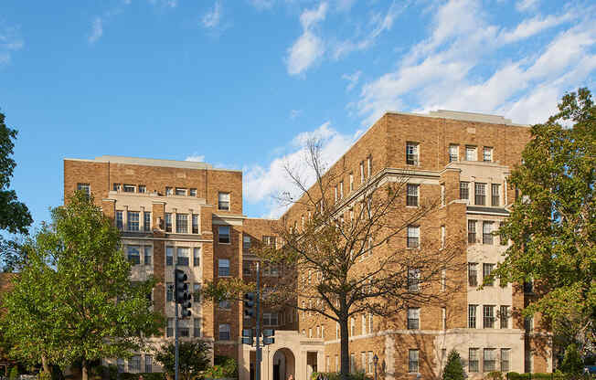 a large brick building on the corner of a street