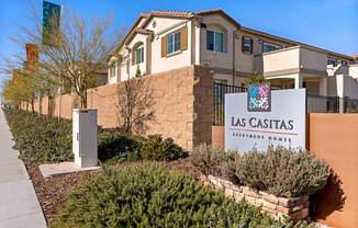 a building with a sign for the las casitas municipal hotel