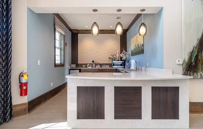 A reception area with a white counter and brown shades.