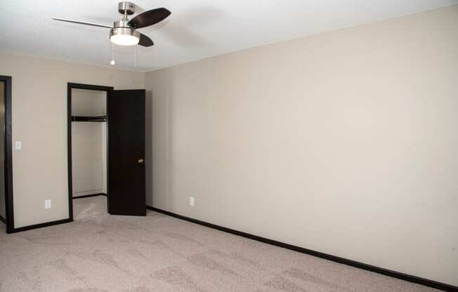 One bedroom with ceiling fan and large closet