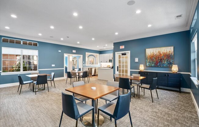 A room with a long table and chairs.