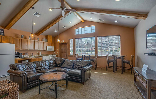 Quail Springs Apartments clubhouse. large couch and big windows